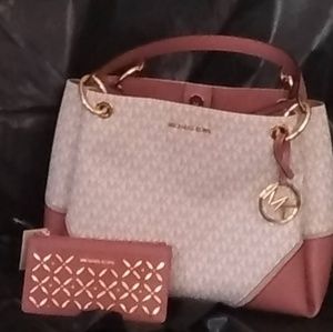 Micheal Kors luxery handbag and matching wallet.